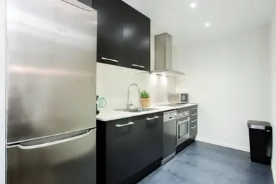 a glass door to a building with a balcony at The Collection Barcelona - Bright and modern 3bedroom in Las Ramblas 3 1B in Barcelona