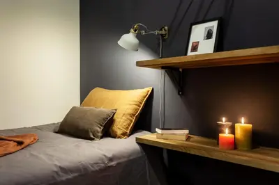 a bedroom with a bed with two candles and a desk at The Collection Barcelona - Plaza Catalunya cozy 4 Bedroom in Barcelona