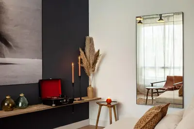 a living room with a couch and a mirror at The Collection Barcelona - Plaza Catalunya cozy 4 Bedroom in Barcelona