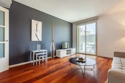 a living room with a couch and a table at The Collection Barcelona - Plaça Catalunya Modern 2bedroom with balcony in Barcelona