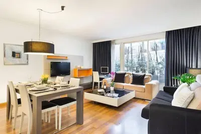 a living room with a table and a couch at The Collection Barcelona - Central and Elegant 4 Bedroom by Placa Catalunya in Barcelona