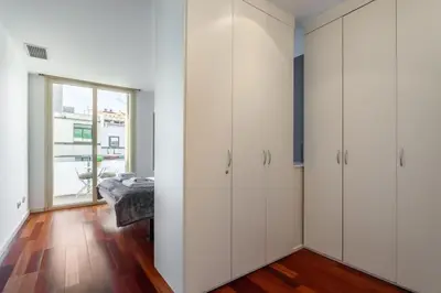 a bathroom with a toilet and a glass shower at The Collection Barcelona - 3bedroom Duplex with balcony in plaza Cataluña in Barcelona