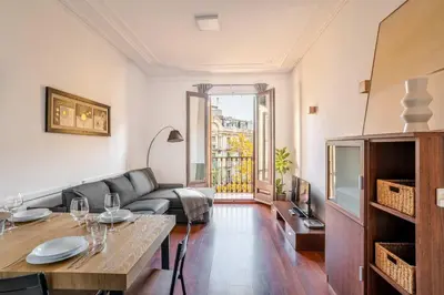 a group of trees in front of tall buildings at The Collection Barcelona - Ronda Sant Pere Private City Center 3Bedroom Suite B in Barcelona