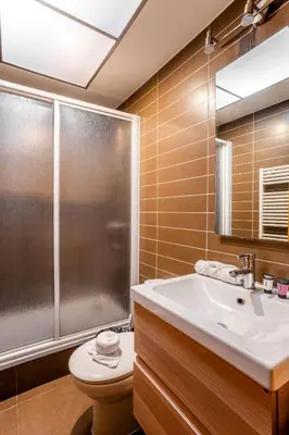 an empty room with a large window and a chandelier at The Collection Barcelona - Ronda Sant Pere Private City Center 3Bedroom Suite B in Barcelona