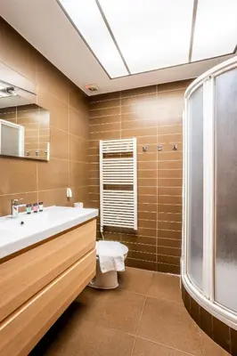 a large bed in a room with a ceiling fan at The Collection Barcelona - Plaza Urquinaona 3-Bedroom Suite in Barcelona