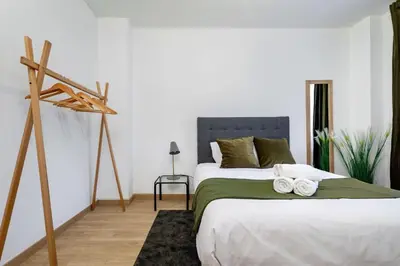 a bathroom with a toilet and a sink and a mirror at The Collection Barcelona - Exclusive Huge 4 Double Bedroom City Center in Barcelona
