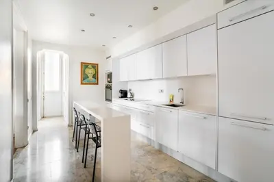 a bedroom with a bed and a book shelf with books at The Collection Barcelona - Placa Catalunya Luminous and Exclusive 5Bd Penthouse in Barcelona
