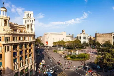 a living room with a couch and a tv at The Collection Barcelona - Placa Catalunya Luminous and Exclusive 5Bd Penthouse in Barcelona