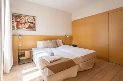 a bedroom with a large bed in a room at The Collection Barcelona - Classy 3bed 3bath apartment in Eixample in Barcelona