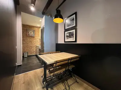 a dining room with a wooden table and chairs at Stay U-nique Apartments Est in Barcelona