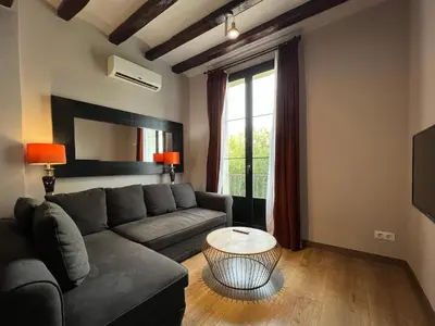 a living room with a couch and a table at Stay U-nique Apartments Est in Barcelona