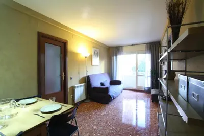 a living room with a couch and a table at GOOD APARTMENTS gran via 3 bedrooms in Barcelona