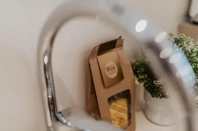 a reflection of a bag of food in a mirror at Petit Luxe Volta Apartaments in Terrassa