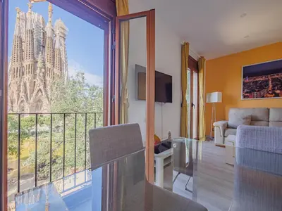 a living room with a balcony with a view at Absolute Sagrada Familia in Barcelona
