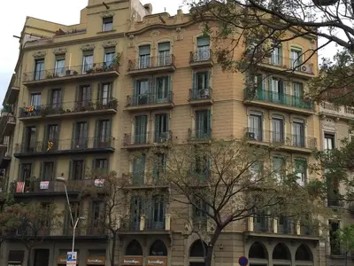 a large building with balconies on the side of it at Whatching Sagrada Familia in Barcelona