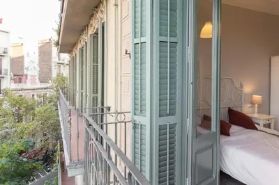 a bedroom with a bed on a balcony at Whatching Sagrada Familia in Barcelona
