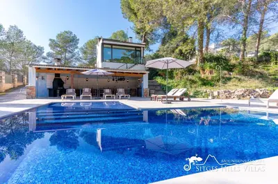 a swimming pool with a house on top of it at Spacious Villa Santa Fe - private pool, big garden and A/C close to Sitges in Olivella