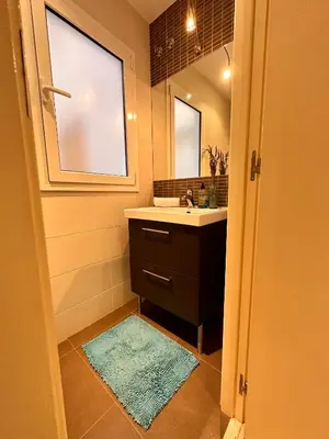 a bathroom with a sink and a mirror at Gracia Barcelona Apartment in Barcelona
