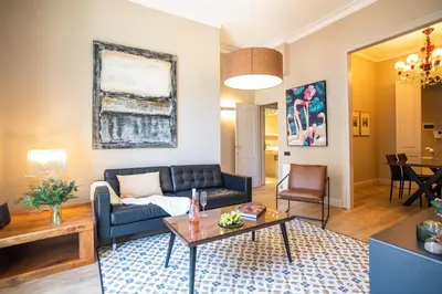 a living room with a couch and a table at Tendency Apartments 6 in Barcelona
