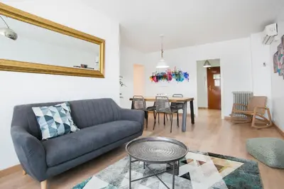 a living room with a couch and a table at Tendency Apartments 6 in Barcelona