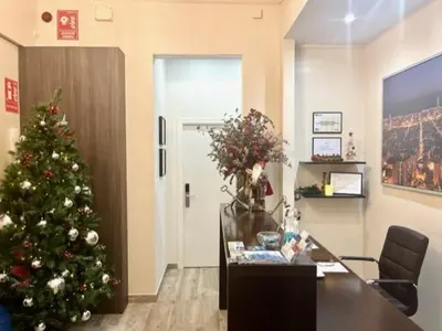 a christmas tree in an office with a desk at Front Arc in Barcelona