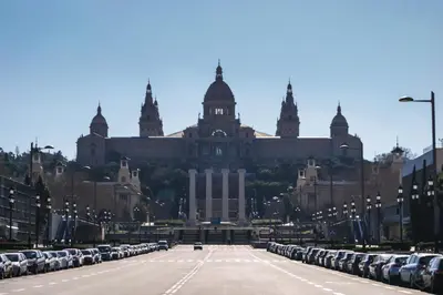 an empty parking lot in front of a large building at La Fira in Barcelona