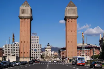 two tall towers in a city with a street at Molino Fresh in Barcelona
