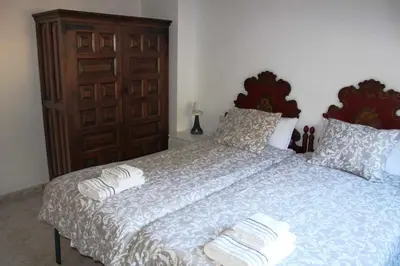 a bedroom with a bed with two towels on it at VACACIONES EN MARESME CASA PARA 7 PERSONAS in Sant Iscle de Vallalta