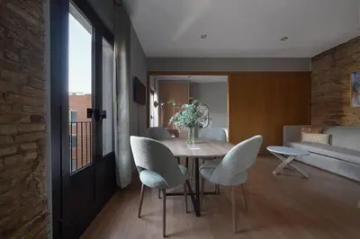 a living room with a couch and a table at Numa Barcelona Lustre in Barcelona