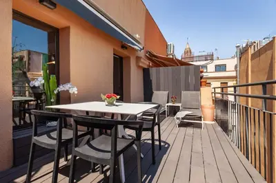 a tall building with trees in front of it at The Collection Barcelona - 3-bedroom penthouse with terrace in Eixample in Barcelona