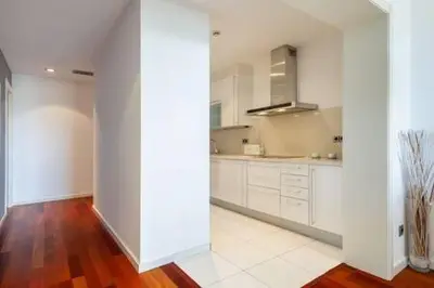 a white room with two beds and a desk at The Collection Barcelona - Wonderful 2-bd apart with balcony Plaza Cataluña in Barcelona