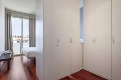 a dining room with a white table and chairs at The Collection Barcelona - Wonderful 2-bd apart with balcony Plaza Cataluña in Barcelona