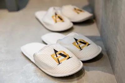 a group of white sandals with gold on them at AB BOUTIQUE HOTEL - Adults only in Sant Vicenç de Montalt