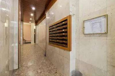 a hallway of a wine cellar with a display of wine bottles at Stay U-nique Apartments La Bordeta in Barcelona