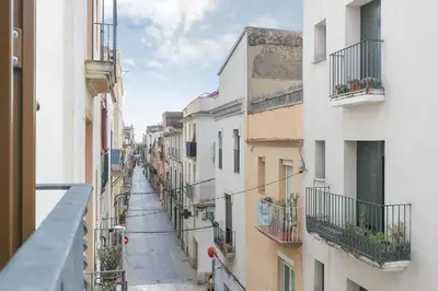 a view of an alley between two buildings at NICE CENTRIC APARTMENT in Vilanova i la Geltrú