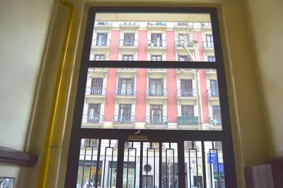 a window view of a building from a building at BizFlats Eixample Apartments in Barcelona