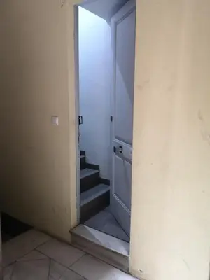 a hallway with a door and stairs in a room at ApartEasy - Eixample Center in Barcelona