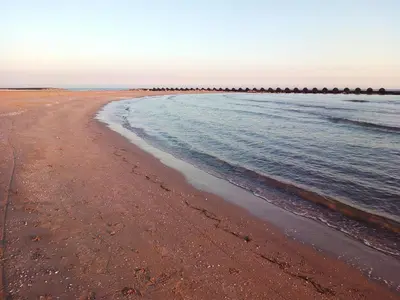 a sandy beach with the ocean in the background at Villa Playa y Montaña in Cunit
