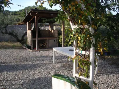 a living room with a piano and two chairs at MAS GUILLO in San Quintín de Mediona