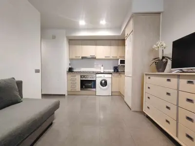 a small kitchen with a washer and dryer at Mazi Apartments Nest in Mataró