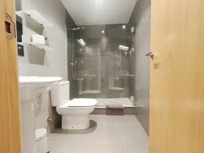 a bathroom with a shower and a toilet and a sink at Mazi Apartments Nest in Mataró