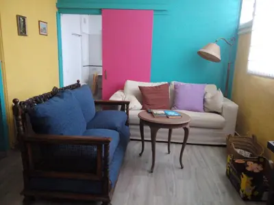 a living room with a couch and a table at LA NURSERY DE MAS GUILLO in San Quintín de Mediona