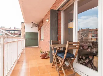a balcony with a table and chairs on it at Private terrace at Sagrada Familia in Barcelona