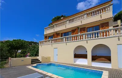 a house with a swimming pool in front of it at Nice Home In Sant Cebria De Vallalt in Sant Cebrià de Vallalta