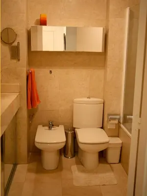 a small bathroom with a toilet and a sink at Enric Granados 15 in Barcelona