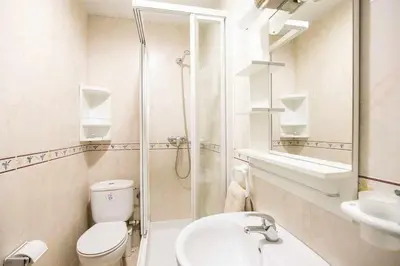 a bathroom with a toilet and a sink and a shower at Port VIII Apart céntrico en Paralelo cerca Rambla in Barcelona