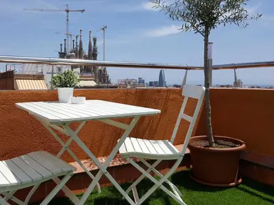 a white table and chairs on a balcony with a tree at Your Home in Barcelona Apartments in Barcelona