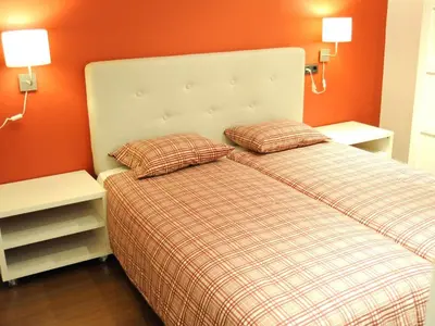a bedroom with a bed with two pillows on it at Your Home in Barcelona Apartments in Barcelona