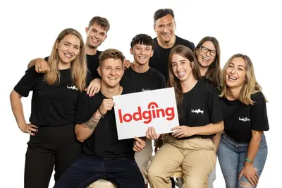 a group of people wearing black shirts holding a sign at Lodging Apartments Liceu G1 in Barcelona