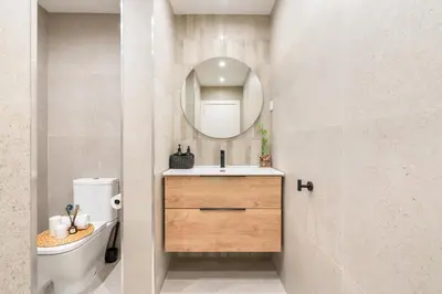 a bathroom with a sink and a mirror at Lodging Apartments Liceu G2 in Barcelona